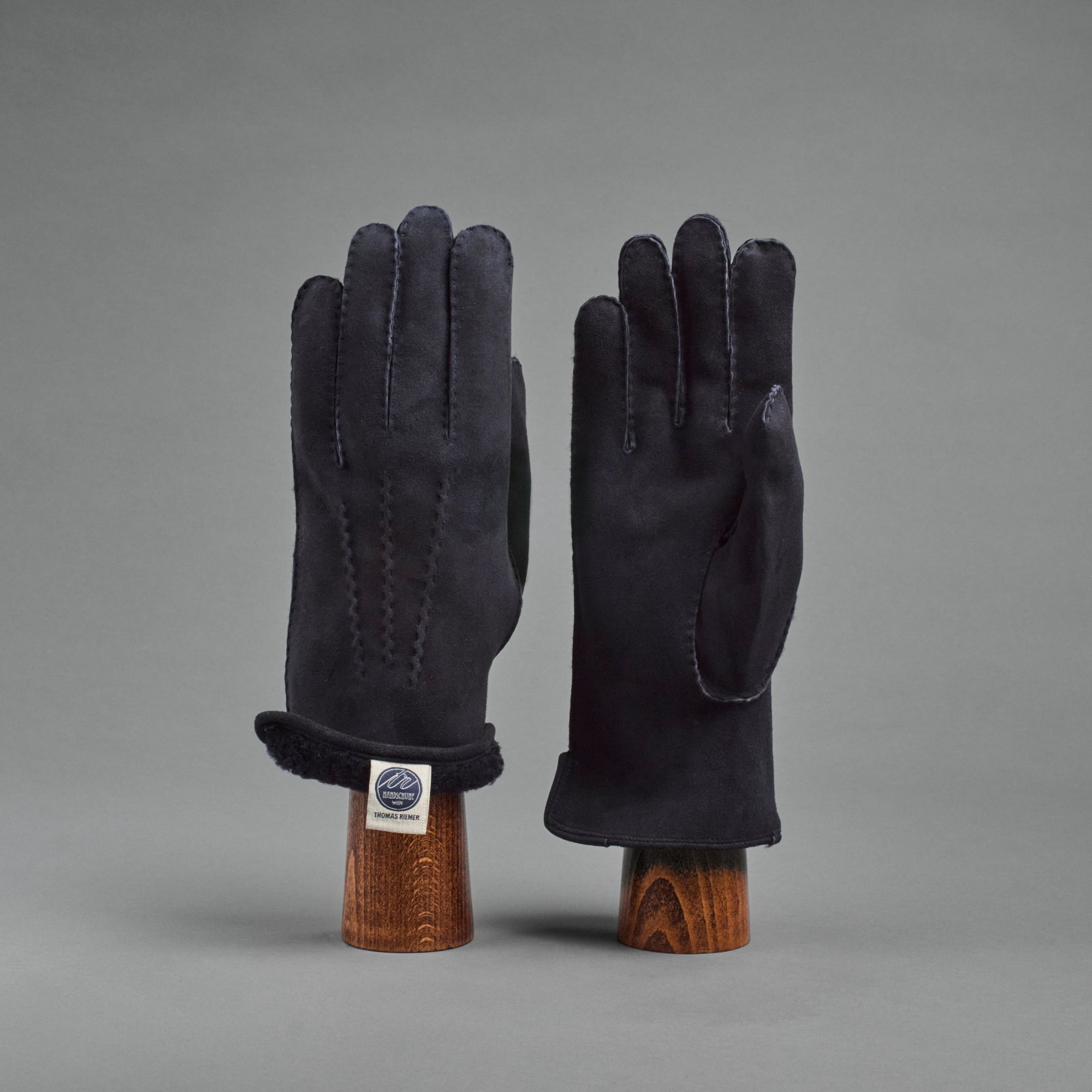 Herrenhandschuhe aus dunkelblauem gelocktem Lammfell