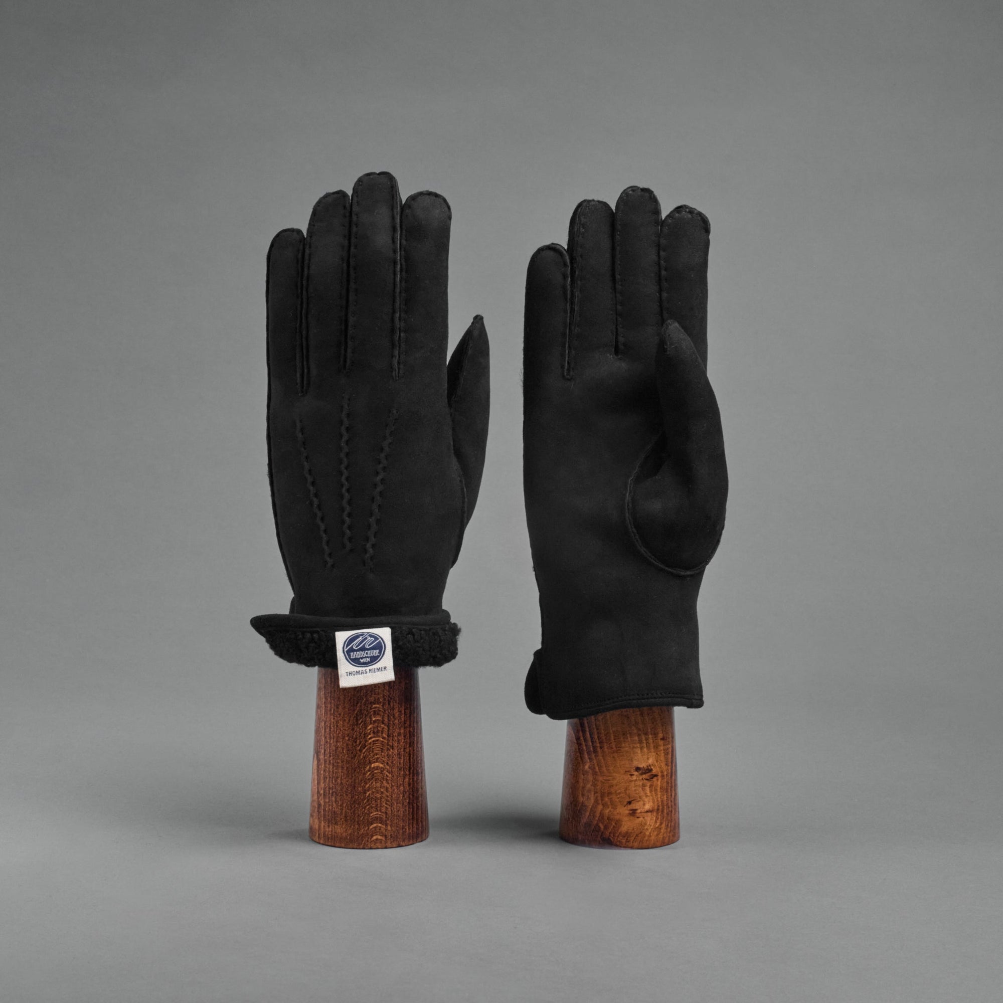 Damenhandschuhe aus schwarzem gelocktem Lammfell